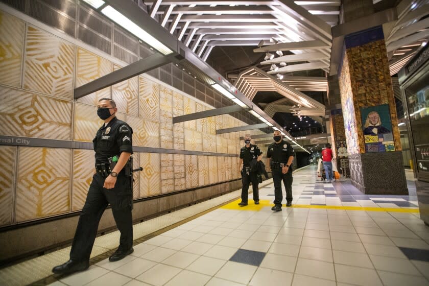 HOLLYWOOD, CA - JUNE 25: LAPD officers patrol the Metro Hollywood/Highland station at the Metro Hollywood/Highland Station Thursday, June 25, 2020 in Hollywood, CA. The Metro Board of Directors will meet. The agenda includes the consideration of appointing a committee to develop plans for replacing armed transit safety officers with ``smarter and more effective methods of providing public safety.'' (Allen J. Schaben / Los Angeles Times)