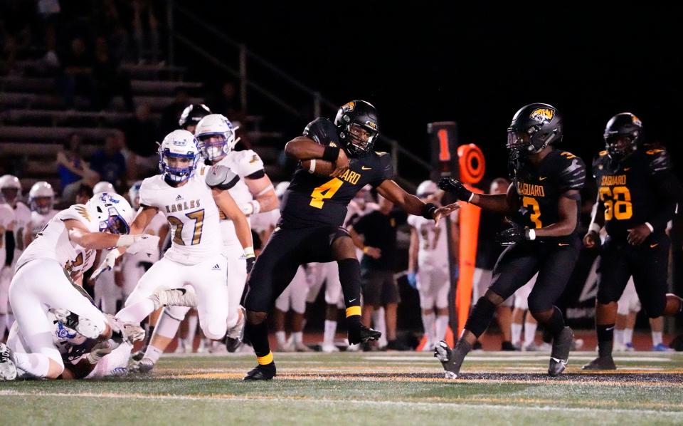 Sep 16, 2022; Scottsdale, Arizona, USA; Saguaro Sabercats quarterback Devon Dampier (4) carries the ball against the Sandra Day O'Connor Eagles during a game played at Saguaro High.