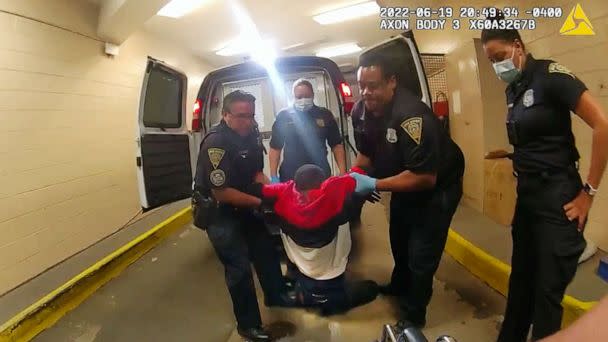PHOTO: In this image taken from police body camera video provided by New Haven Police, Richard 'Randy' Cox is pulled from the back of a police van and placed in a wheelchair after being detained by New Haven Police, June 19, 2022, in New Haven, Conn. (New Haven Police via AP, FILE)