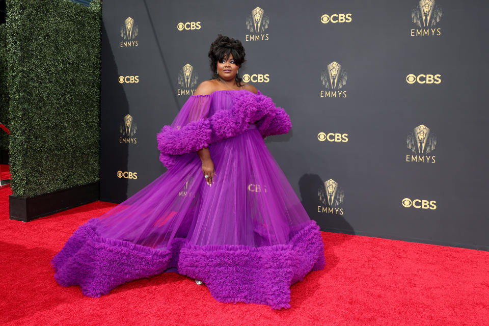 Nicole Byer wears a purple gown at the 73rd Primetime Emmy Awards at L.A. LIVE on September 19, 2021 in Los Angeles, California. (Photo by Rich Fury/Getty Images)