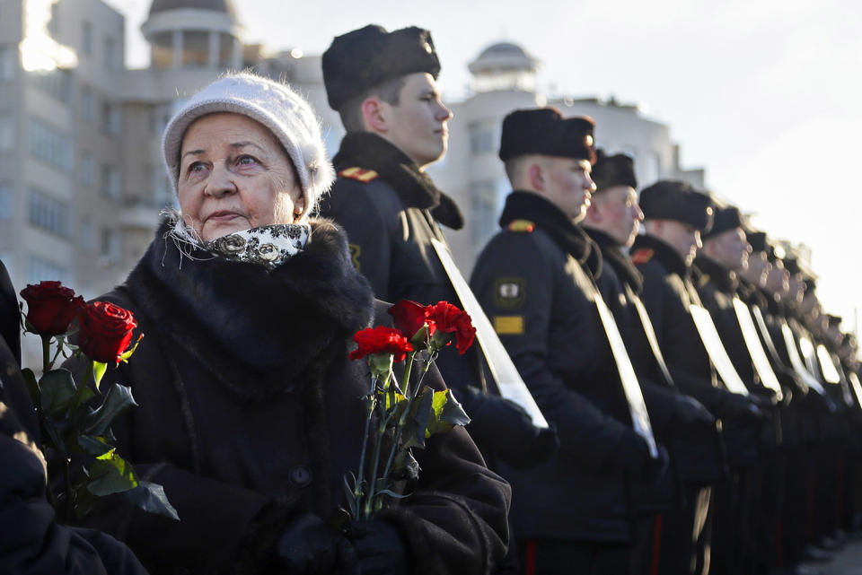 Women holds flowers at ceremony