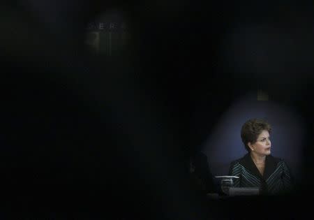 Brazilian President Dilma Rousseff reacts after receiving the report from the "truth commission" in Brasilia December 10, 2014. REUTERS/Joedson Alves