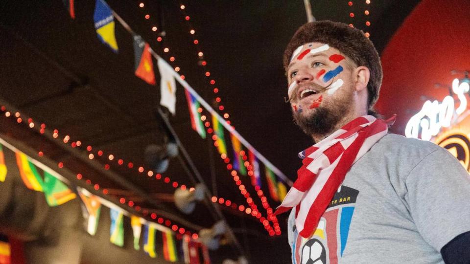 Bar manager Erik Schweitzer reacts to a World Cup USA goal over Iran by jumping on top of the bar to lead a chant at Liga, a sports bar in Downtown Boise, on Tuesday, Nov. 29, 2022.