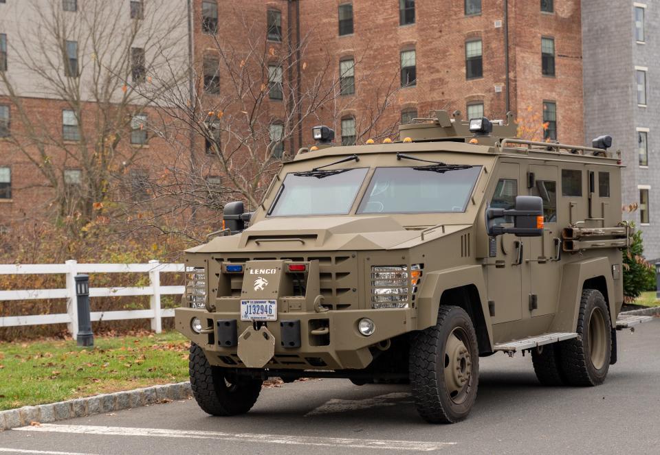 Authorities are continuing a massive search in the small borough for a man wanted for his role in the Jan. 6 Capitol riots, including an armored vehicle parked at the command center at the Helmetta Community Center.