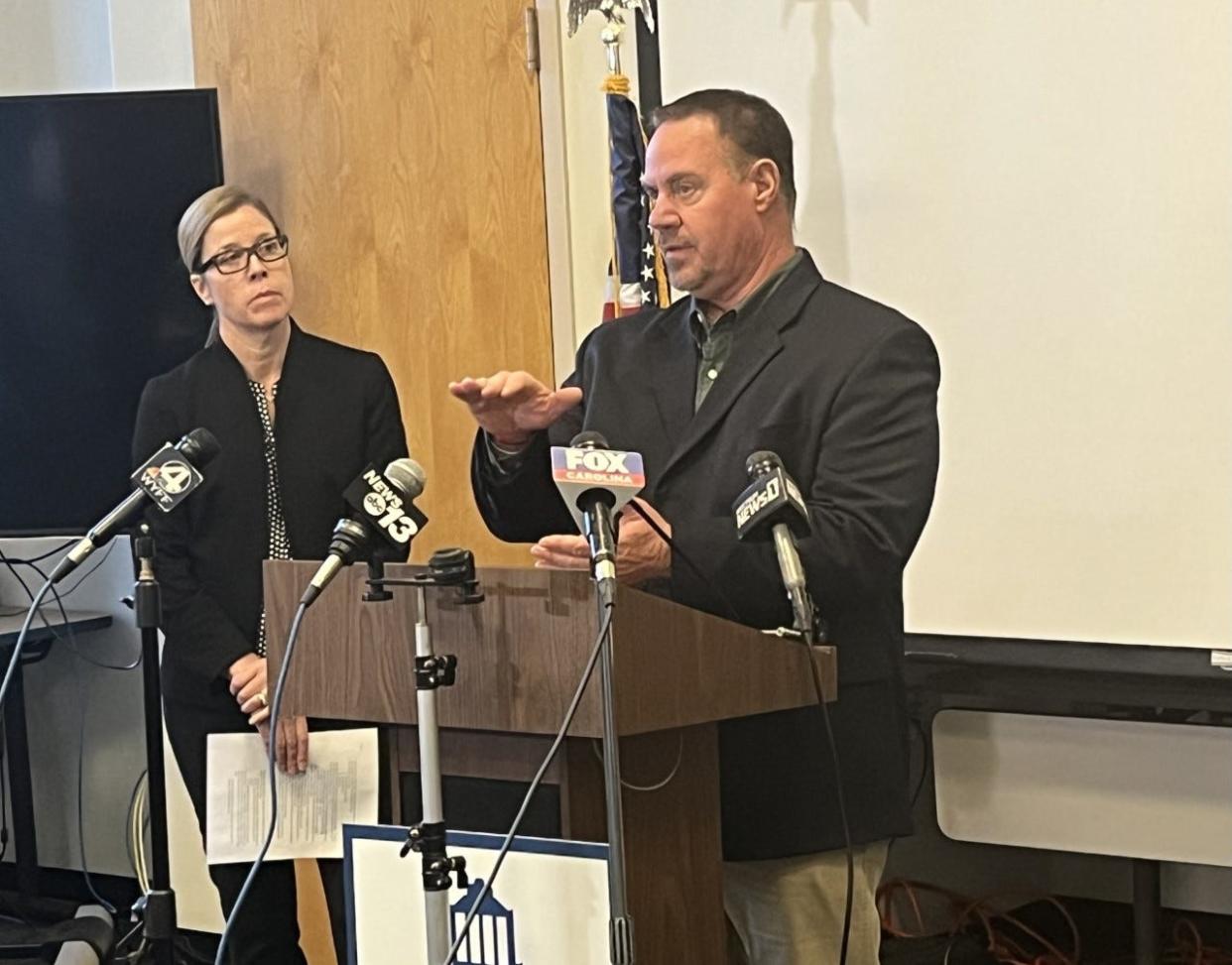 Mayor Esther Manheimer listens in as Water Resources Director David Melton briefs local press Dec. 28.