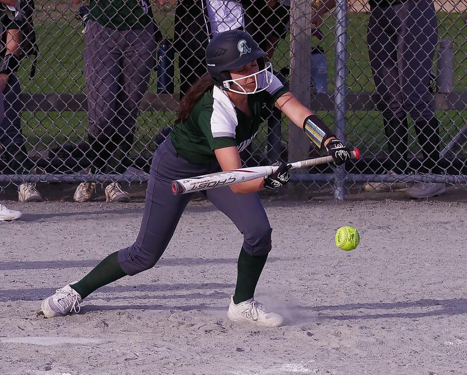 Elsie Testa makes a bunt trying to get a scoring run going late in the game against Middleboro on Tuesday, April 11, 2023.