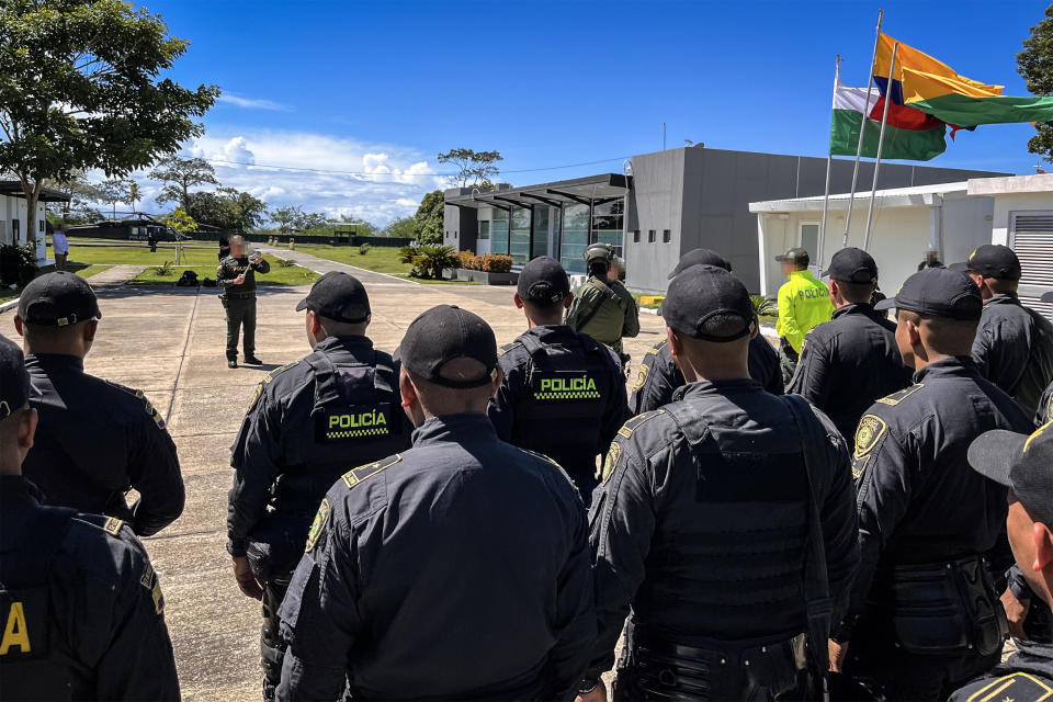 U.S. and Colombian law enforcement gather for a tactical briefing before an international human trafficking operation. (NBC News)