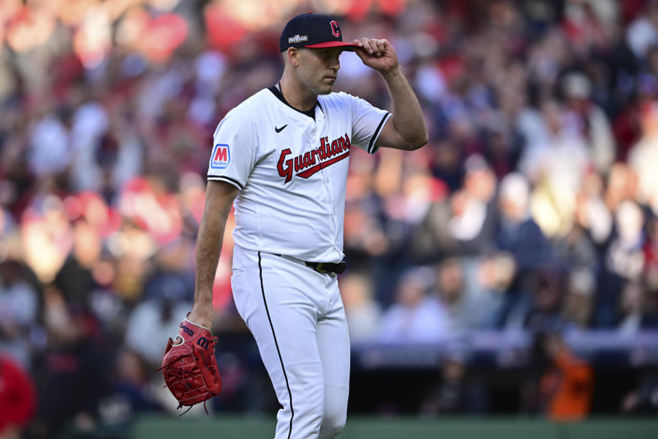 Cleveland Guardians starting pitcher Matthew Boyd tips his cap to the crowd as he walks off the field after being taken out of the game in the fifth inning during Game 2 of baseball's AL Division Series against the Detroit Tigers, Monday, Oct. 7, 2024, in Cleveland. (AP Photo/David Dermer)