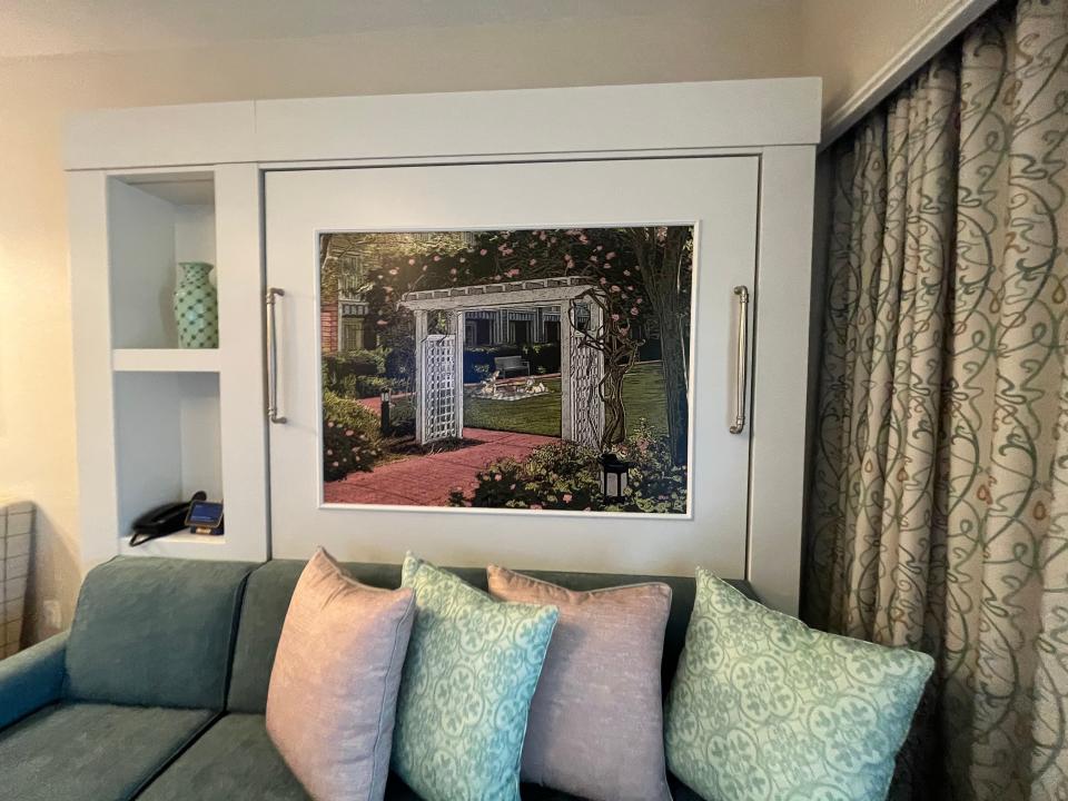 sofa and folded in murphy bed in a villa at disney's boardwalk inn resort