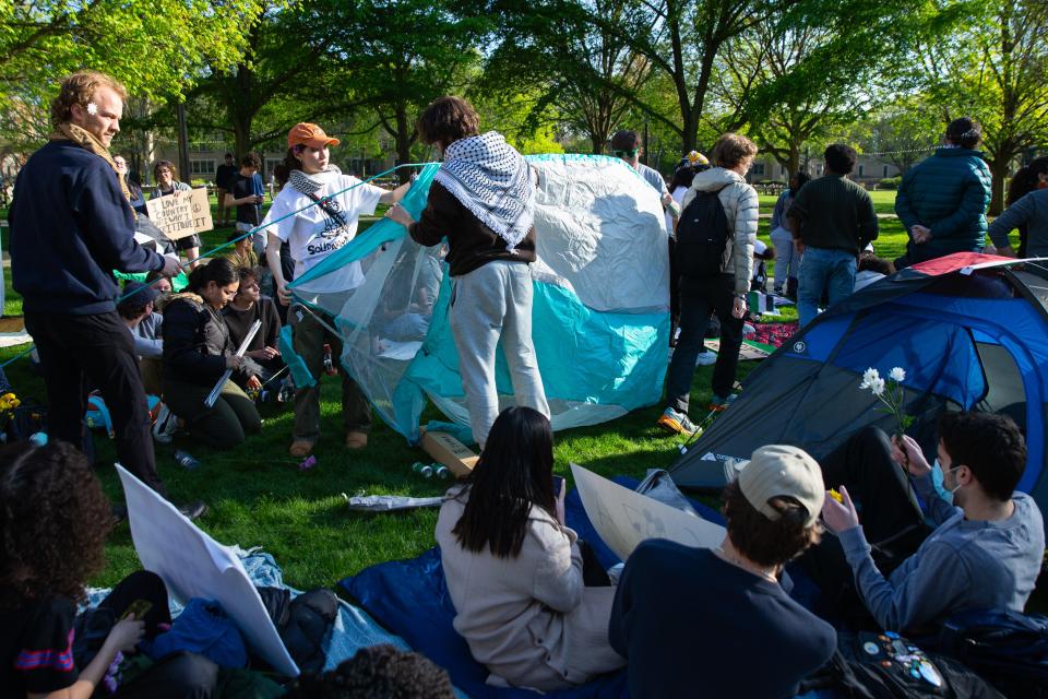 Students and community members build tents that were later torn down by Notre Dame Police during a pro-Palestinian protest on the University of Notre Dame's campus on Thursday, April 25, 2024.