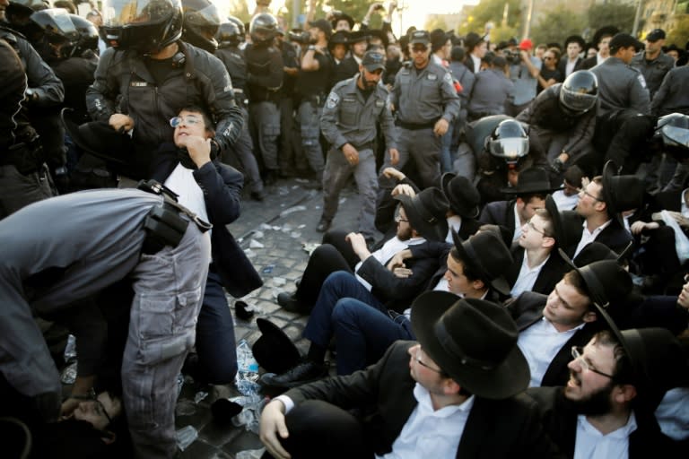 Israeli security forces disperse Ultra-Orthodox Jewish demonstrators during a protest against army conscription in the centre of Jerusalem on October 19, 2017