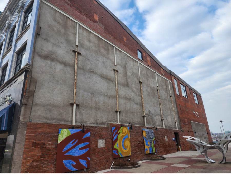 The east-facing wall, of the Quad City Arts building, in Arts Alley.