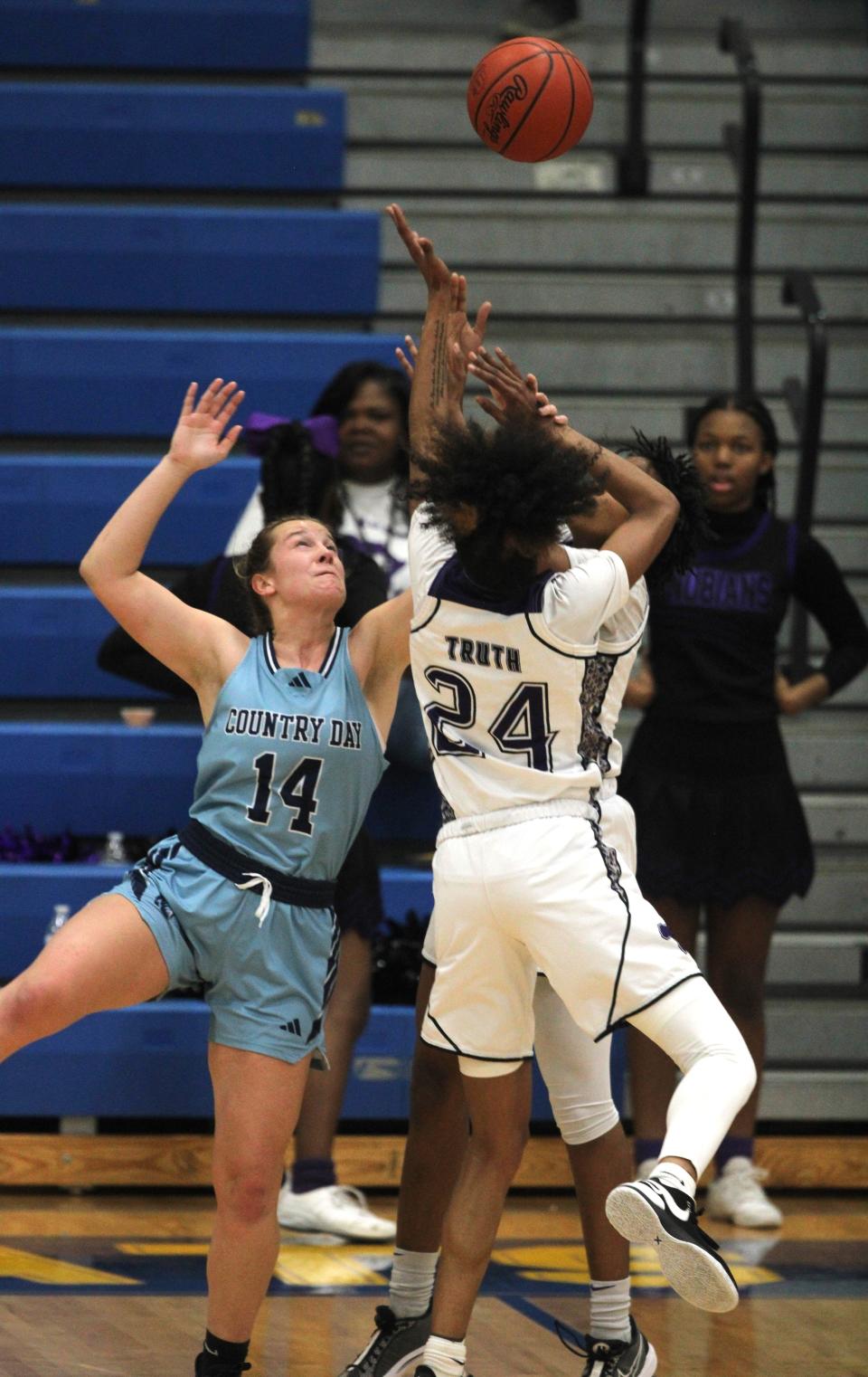 CCD senior Piper Farris (14) tries to disrupt a shot as Cincinnati Country Day lost 61-50 to Columbus Africentric in an OHSAA Division III girls basketball regional semifinal March 6, 2024 at Springfield High School.