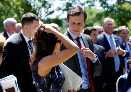 President Donald Trump's son-in-law Jared Kushner speaks with Deputy National Security Advisor Dina Powell in the Rose Garden of the White House in Washington, U.S., May 2, 2017. REUTERS/Joshua Roberts