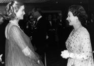 <p>Actress Cybill Shepherd was pregnant when she met the queen at the premiere of <em>The Lady Vanishes</em> in 1979, but that didn’t hold her back. Her fancy meet-the-Queen look: A sheer beaded and feathered caftan dress.<br></p>