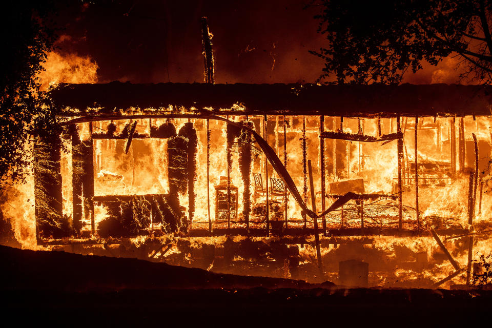 Flames consume a home as the Kincade Fire tears through the Jimtown community of Sonoma County, Calif., on Thursday, Oct. 24, 2019. (Photo: Noah Berger/AP)