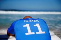 FILE PHOTO: Surfer Kelly Slater prepares for his heat at the Billabong Pipe Masters at the Banzai Pipeline in Pupukea on the island of Oahu