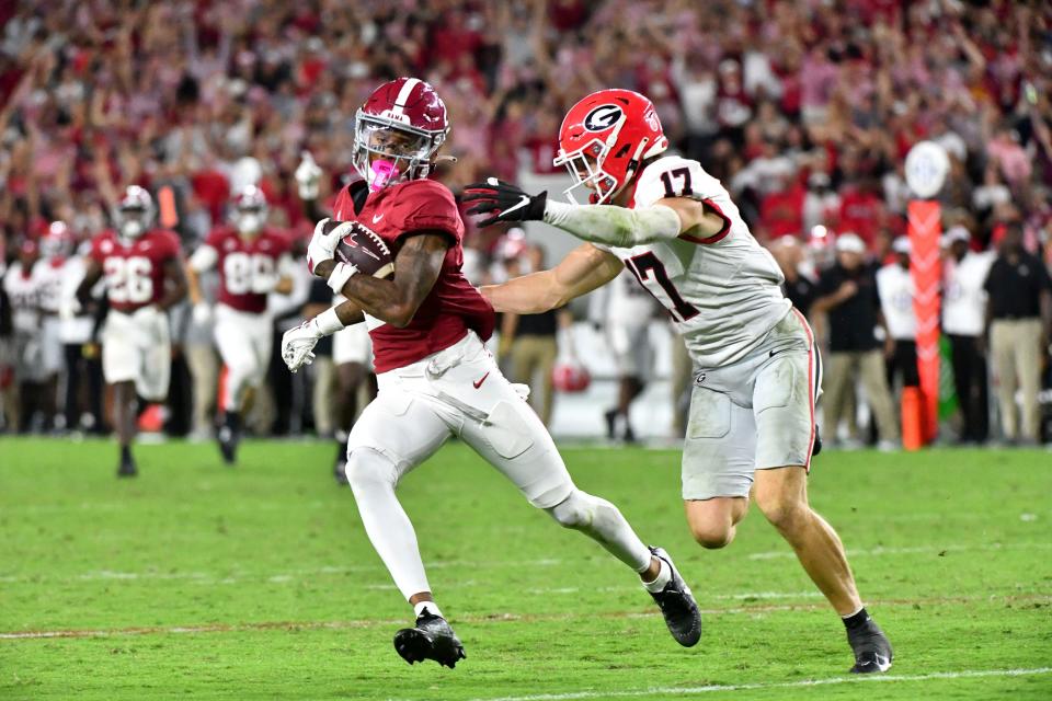 Alabama wide receiver Ryan Williams (2) evades tackles after making a catch against Georgia at Bryant-Denny Stadium.