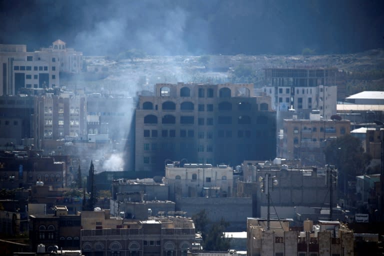 Smoke billows over the rebel-held Yemeni capital Sanaa during clashes between Huthi rebels and supporters of now slain ex-president Ali Abdullah Saleh