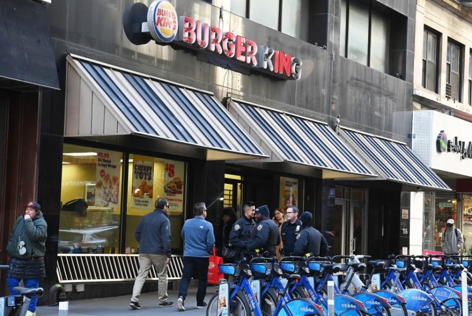 Numerous officers standing outside the Burger King this week, days after Mayor Adams paid a surprise visit. Helayne Seidman