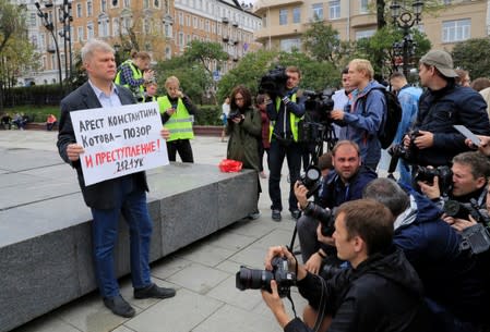 Russian opposition politician Sergei Mitrokhin takes part in a protest demanding authorities to allow opposition candidates to run in the upcoming local election and release people arrested for participation in opposition rallies, in Moscow