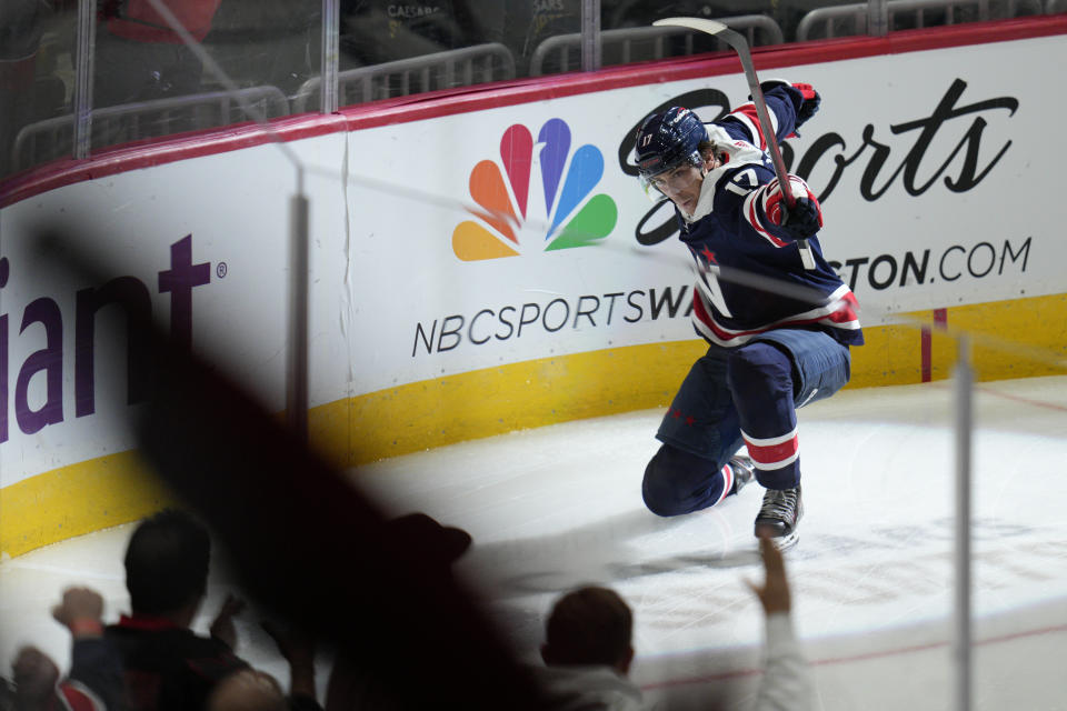 Washington Capitals center Dylan Strome (17) celebrates after scoring a goal during the third period of an NHL hockey game against the Vancouver Canucks, Monday, Oct. 17, 2022, in Washington. (AP Photo/Jess Rapfogel)