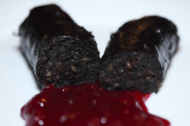 A type of black pudding known as Mustamakkara is served with a lingonberry sauce