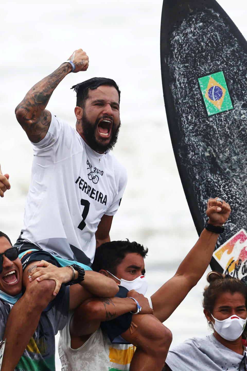 <p>ICHINOMIYA, JAPAN - JULY 27: Italo Ferreira of Team Brazil shows emotion as he is chaired off the beach after winning the Gold Medal in the menâs Surfing final match against Kanoa Igarashi of Team Japan on day four of the Tokyo 2020 Olympic Games at Tsurigasaki Surfing Beach on July 27, 2021 in Ichinomiya, Chiba, Japan. (Photo by Ryan Pierse/Getty Images)</p> 