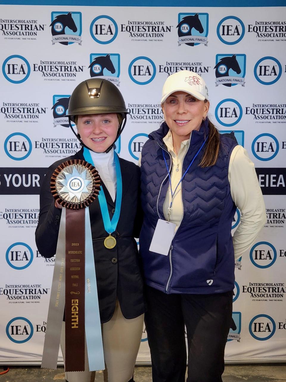 Pictured is Emma Abbott, left, with Donna Rothman, IEA team coach and owner of Stonehaven Farms in Temperance. Abbott competed at Hunt Seat National Finals in Tryon, N.C., and placed eighth in the nation in the individual novice division.