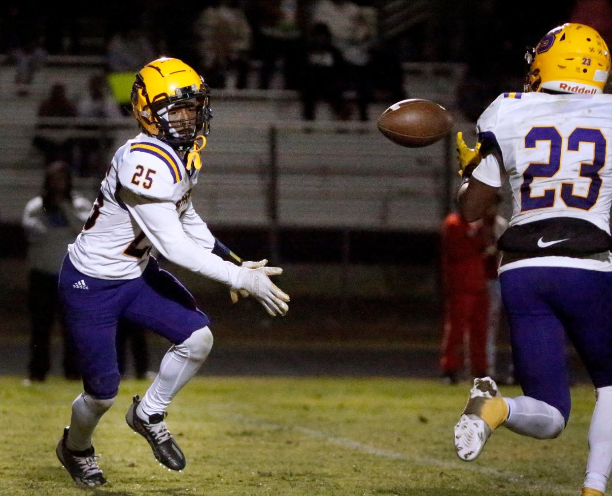 Smyrna's Michael Robinson (25) tosses the ball to Smyrna's Thomas Jones (23) during the football game against Antioch as they attempt a 2-point conversion on Friday, Oct. 20, 2023, at Antioch High School.