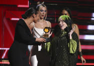 Alicia Keys, from left, and Dua Lipa present Billie Eilish with the award for best new artist at the 62nd annual Grammy Awards on Sunday, Jan. 26, 2020, in Los Angeles. (Photo by Matt Sayles/Invision/AP)