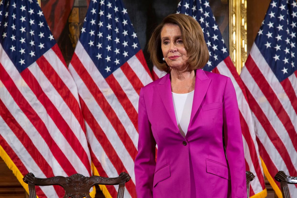 Speaker of the House Nancy Pelosi, D-Calif., waits for her new committee chairs to assemble for a formal photo at the Capitol in Washington, Friday, Jan. 11, 2019. (AP Photo/J. Scott Applewhite) ORG XMIT: DCSA109