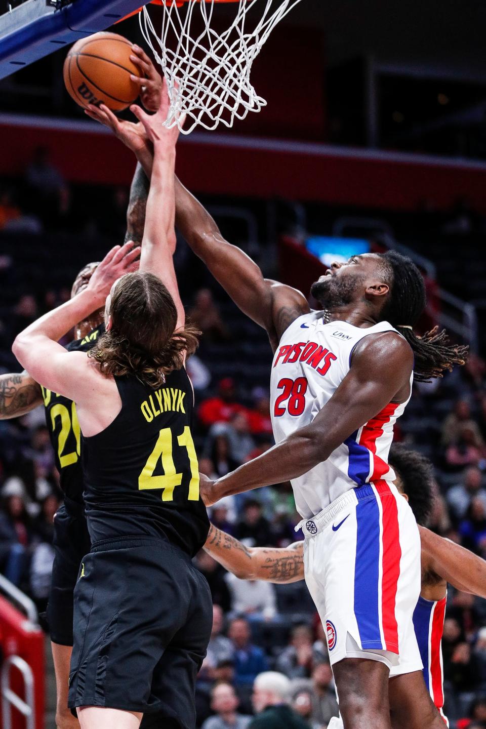 Detroit Pistons center Isaiah Stewart (28) and Utah Jazz forward Kelly Olynyk (41) battle for a rebound during the second half at Little Caesars Arena in Detroit on Thursday, Dec. 21, 2023.