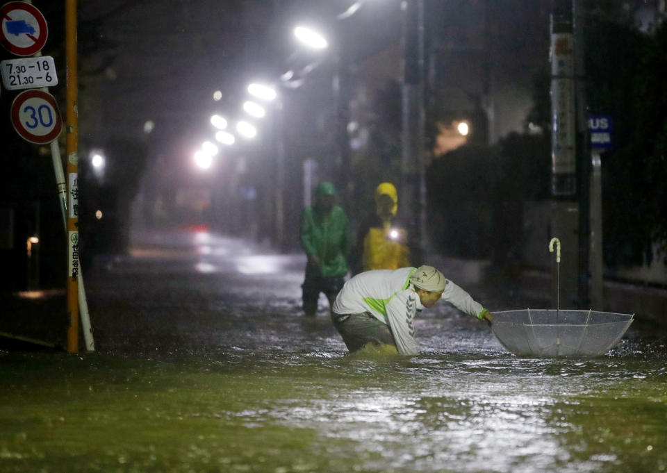 Roads are flooded due to heavy rains caused by Typhoon Hagibis at Setagaya ward in Tokyo, Japan, October 12, 2019, in this photo taken by Kyodo Mandatory credit Kyodo/via REUTERS ATTENTION EDITORS - THIS IMAGE WAS PROVIDED BY A THIRD PARTY. MANDATORY CREDIT. JAPAN OUT.