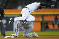 Detroit Tigers shortstop Javier Baez (28) tags Kansas City Royals' Kyle Isbel at second base in the eighth inning of a baseball game in Detroit, Wednesday, Sept. 28, 2022. (AP Photo/Paul Sancya)