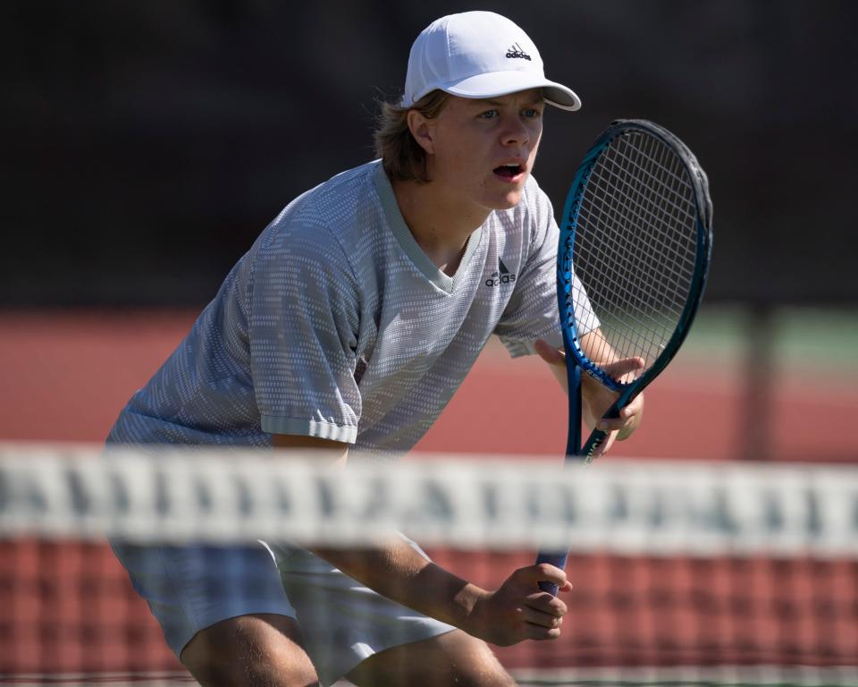 Salina Central Connor Phelps waits for the serve Saturday May. 14, 2022, at Kossover Tennis Court in Topeka.