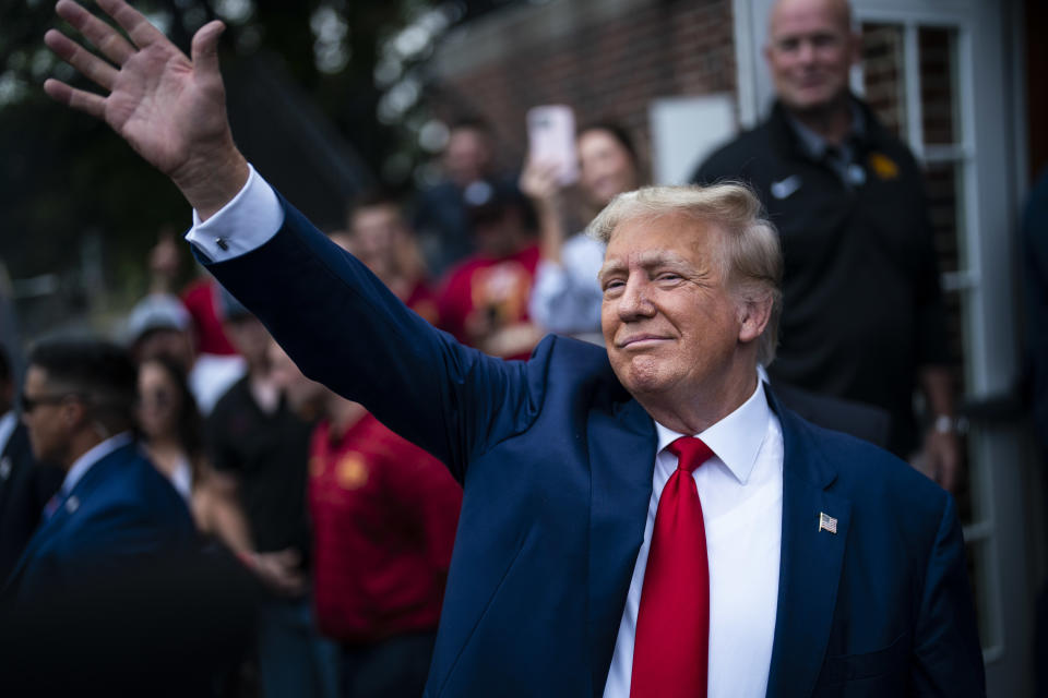 Ames, Iowa - September 9 : Former President Donald Trump greets others while visiting the Alpha Gamma Rho fraternity before a NCAA college football game between Iowa State University and the University of Iowa at Jack Trice Stadium on Saturday, Sept 09, 2023, in Ames, Iowa. (Photo by Jabin Botsford/The Washington Post via Getty Images)