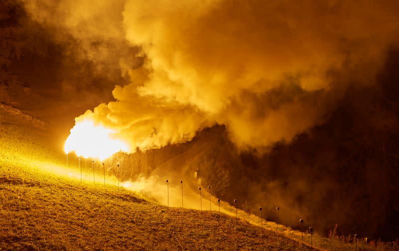 Flares of magnesium powder are pictured during the illumination to celebrate Swiss National Day in Evolene