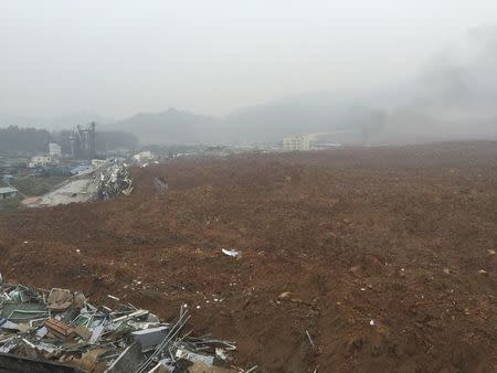 A general view shows buildings covered by mud at the site of a landslide at an industrial park in Shenzhen, Guangdong province, China, December 20, 2015. REUTERS/Stringer
