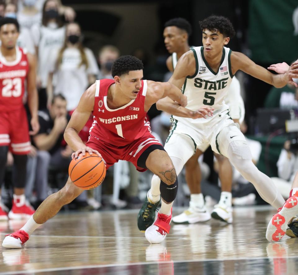Michigan State guard Max Christie defends against Wisconsin guard Johnny Davis during the second half of MSU's 70-62 loss to Wisconsin on Tuesday, Feb. 8, 2022, at the Breslin Center.