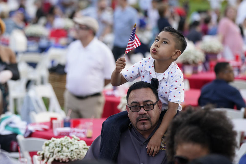 Attendees wait to hear President Joe Biden speak during an Independence Day celebration on the South Lawn of the White House, Sunday, July 4, 2021, in Washington. (AP Photo/Patrick Semansky)