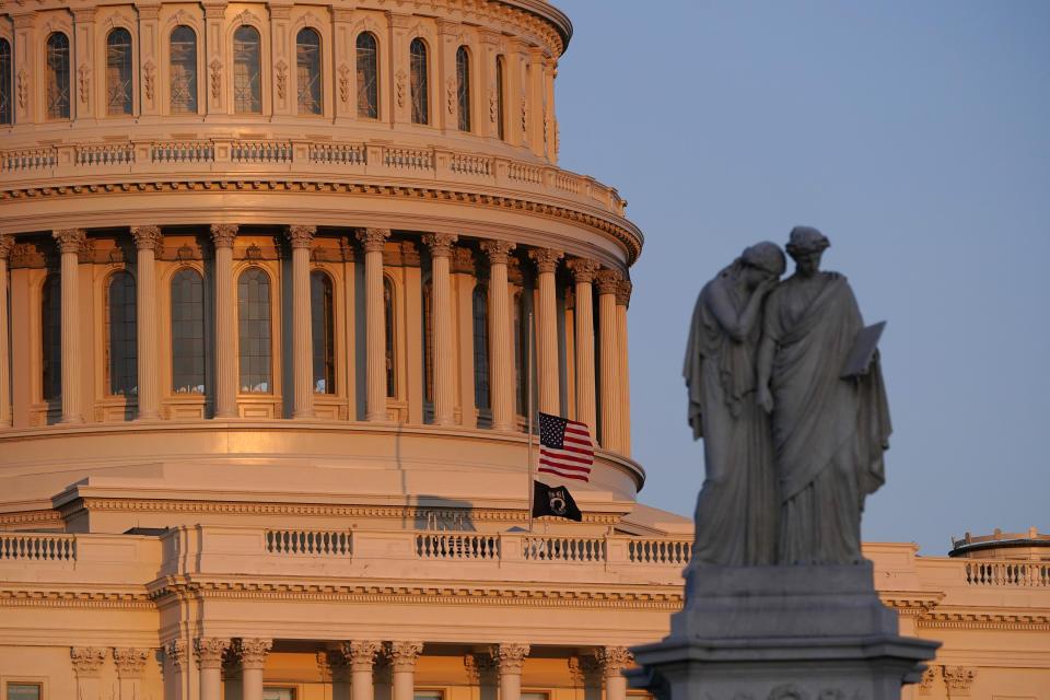 In this April 2, 2021 photo, the American flag at the U.S. Capitol flies at half-staff in honor of Capitol Police officer William “Billy” Evans who was killed after a man rammed a car into two officers at a barricade outside the U.S. Capitol in Washington. Slain U.S. Evans will lie in honor in the Capitol Rotunda on Tuesday. The tribute comes as part of the second such ceremony this year for a force that has edged close to crisis in the wake of the Jan. 6 insurrection. President Joe Biden and congressional leaders will attend a ceremony for Evans, who was killed April 2 when a vehicle rammed into him and another officer at a barricade just 100 yards from the Senate side of the Capitol. (AP Photo/Alex Brandon)