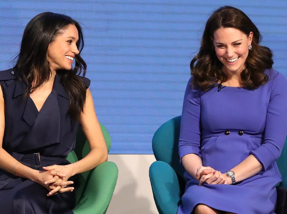 US actress and fiancee of Britain's Prince Harry Meghan Markle (L) and Britain's Catherine, Duchess of Cambridge attend the first annual Royal Foundation Forum on February 28, 2018 in London