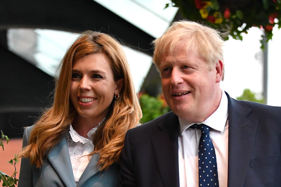 MANCHESTER, ENGLAND - SEPTEMBER 28: British Prime Minister Boris Johnson and his girlfriend Carrie Symonds arrive at the Conservative Party Conference on September 28, 2019 in Manchester, England. Despite Parliament voting against a government motion to award a recess, Conservative Party Conference still goes ahead. Parliament will continue with its business for the duration. (Photo by Jeff J Mitchell/Getty Images)