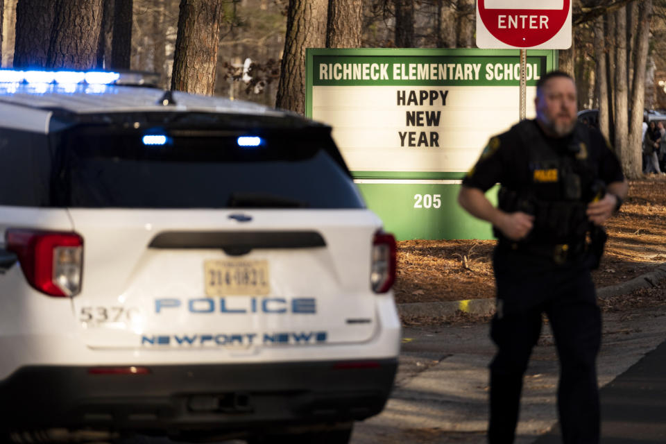 Police respond to a shooting at Richneck Elementary School, Friday, Jan. 6, 2023 in Newport News, Va. A shooting at a Virginia elementary school sent a teacher to the hospital and ended with “an individual” in custody Friday, police and school officials in the city of Newport News said.(Billy Schuerman/The Virginian-Pilot via AP)