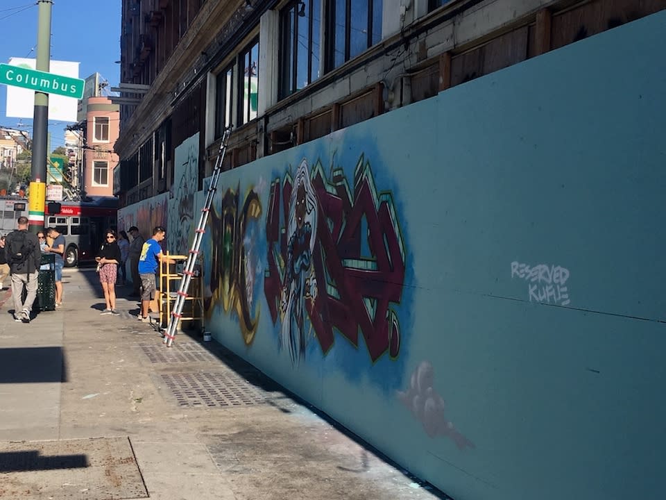 Mural in progress on the corner of Powell and Union streets.