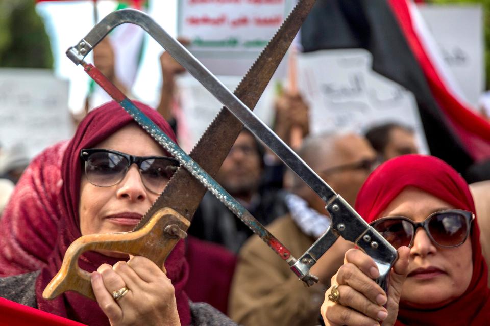 People demonstrate with saws Tuesday Nov. 27, 2018
