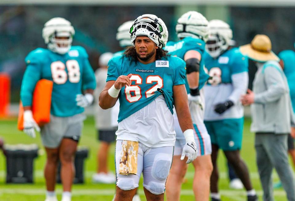 Miami Dolphins center Alama Uluave (62) looks on during a joint practice with the Atlanta Falcons at Baptist Health Training Complex in Hard Rock Stadium on Wednesday, August 9, 2023 in Miami Gardens, Florida.