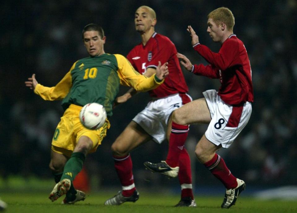 Harry Kewell battles with Rio Ferdinand and Paul Scholes during the international friendly in 2003