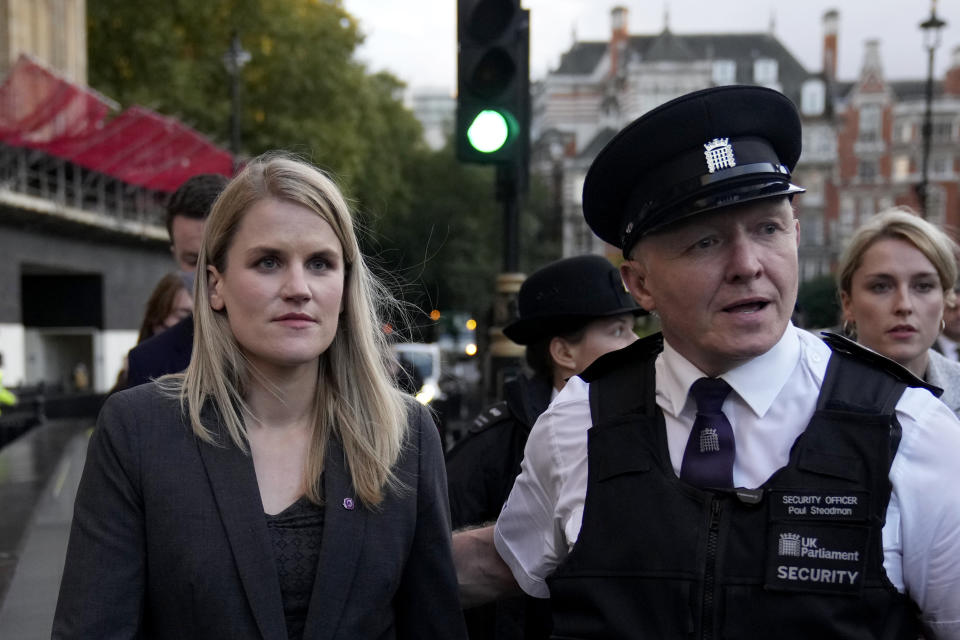 Facebook whistleblower Frances Haugen leaves after giving evidence to the joint committee for the Draft Online Safety Bill, as part of British government plans for social media regulation, at the Houses of Parliament, in London, Monday, Oct. 25, 2021. Facebook whistleblower Frances Haugen told British lawmakers Monday that the social media giant stokes online hate and extremism, fails to protect children from harmful content and lacks any incentive to fix the problems, providing strong momentum for efforts by European governments working on stricter regulation of tech giants. (AP Photo/Matt Dunham)